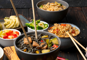 Asian food spread with noodles and vegetables